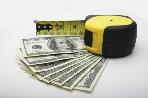 hundred-dollar bills and a tape measure